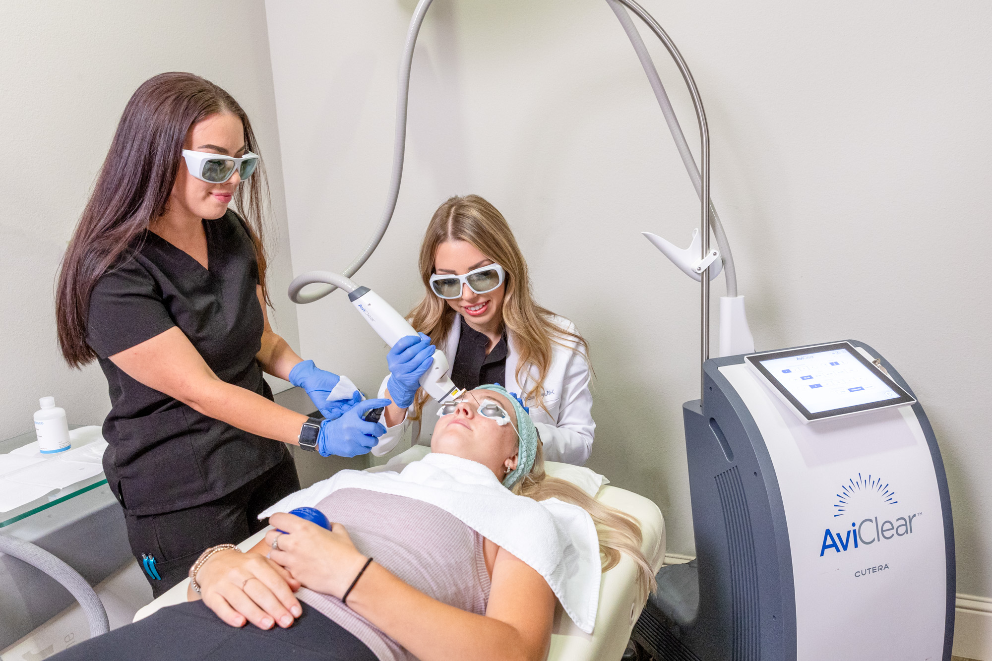 Client receiving AviClear treatment by Dermatology Center of McKinney employees