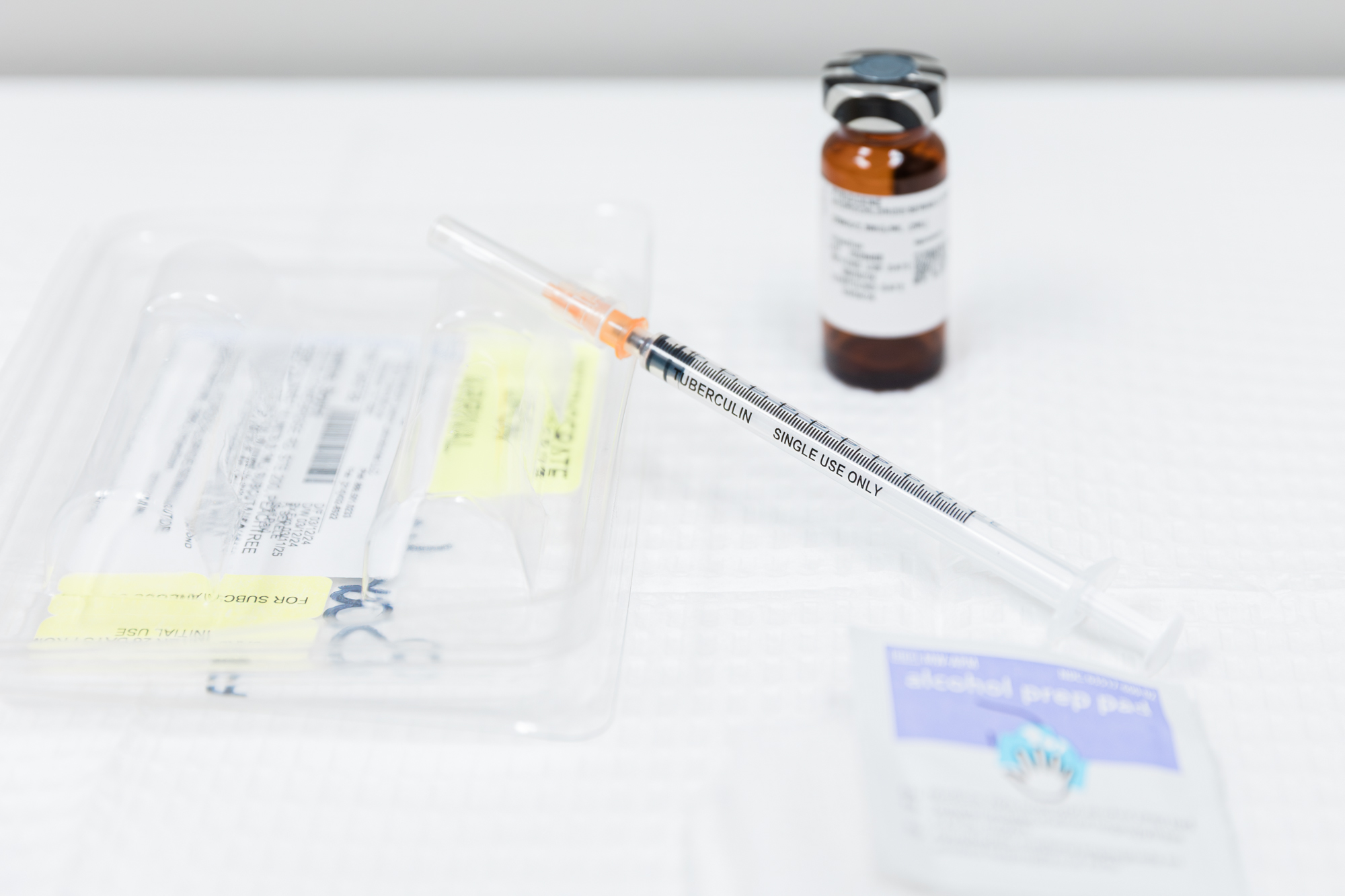 A close-up image of a vial, a syringe, and alcohol prep pads for medical weight loss using tirzepatide in McKinney.